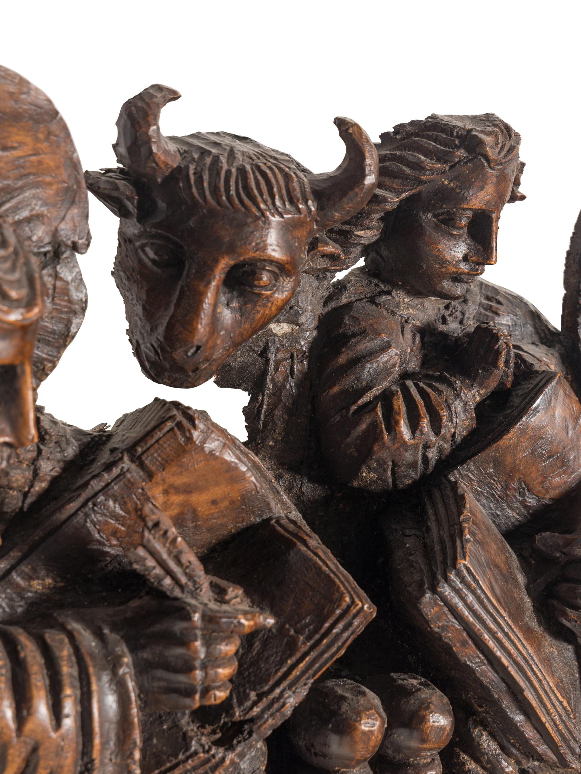 A Spanish Colonial Walnut Frieze Depicting the Four Evangelists