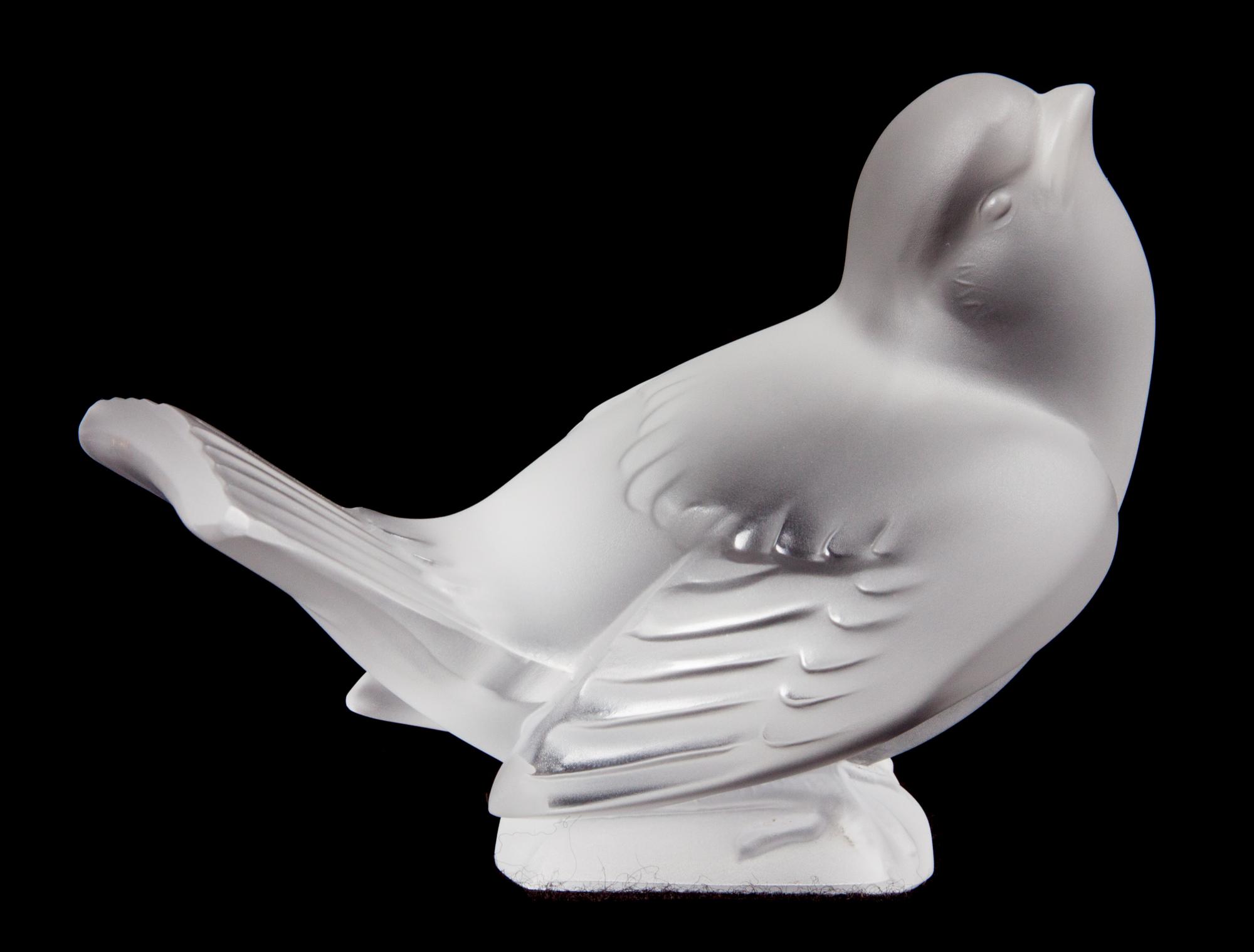 A Lalique Molded and Frosted Glass Bird Figurine Height 3 1/8 inches.
