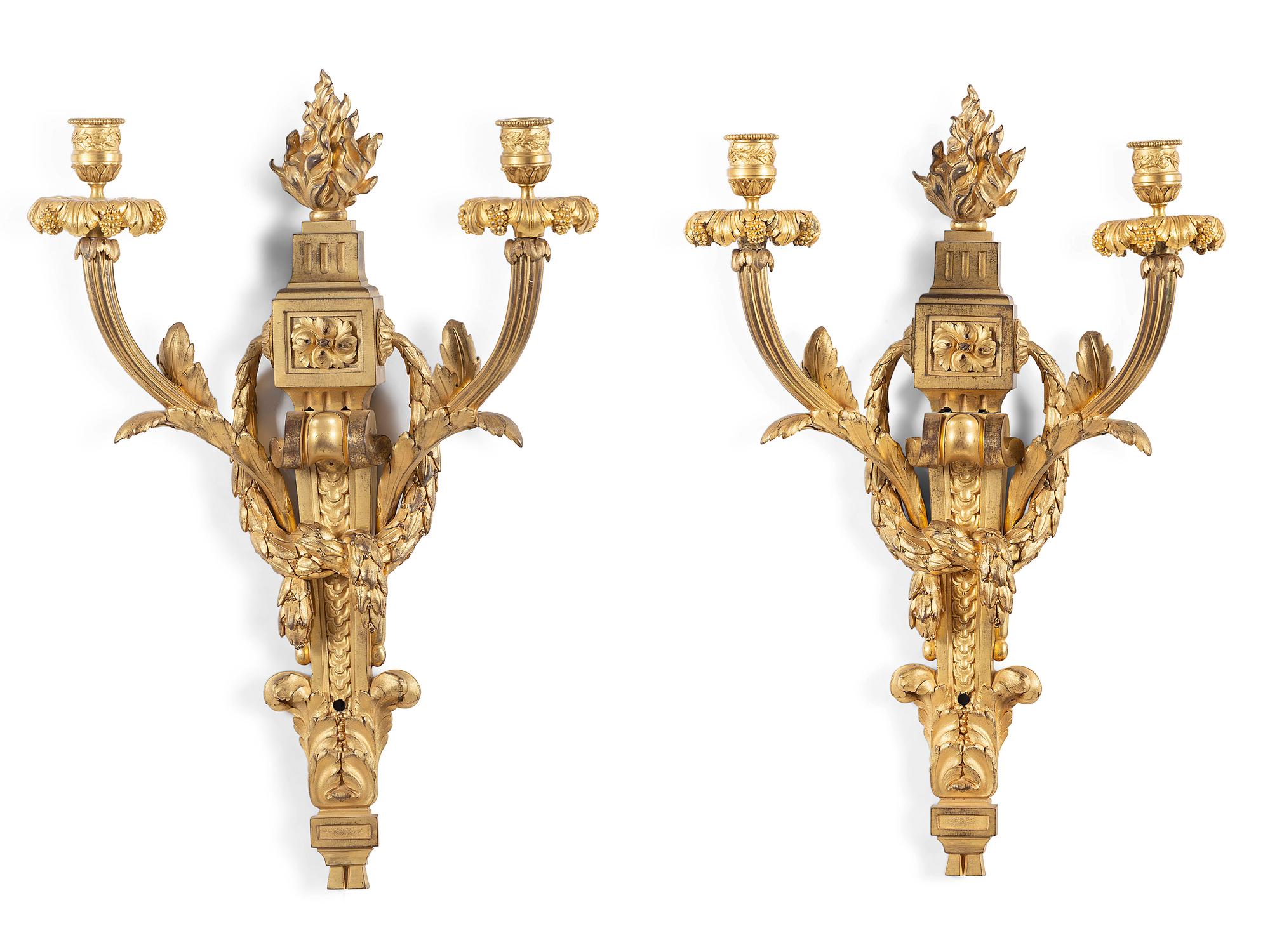A Pair of Louis XVI Gilt Bronze Two Light Wall Sconces