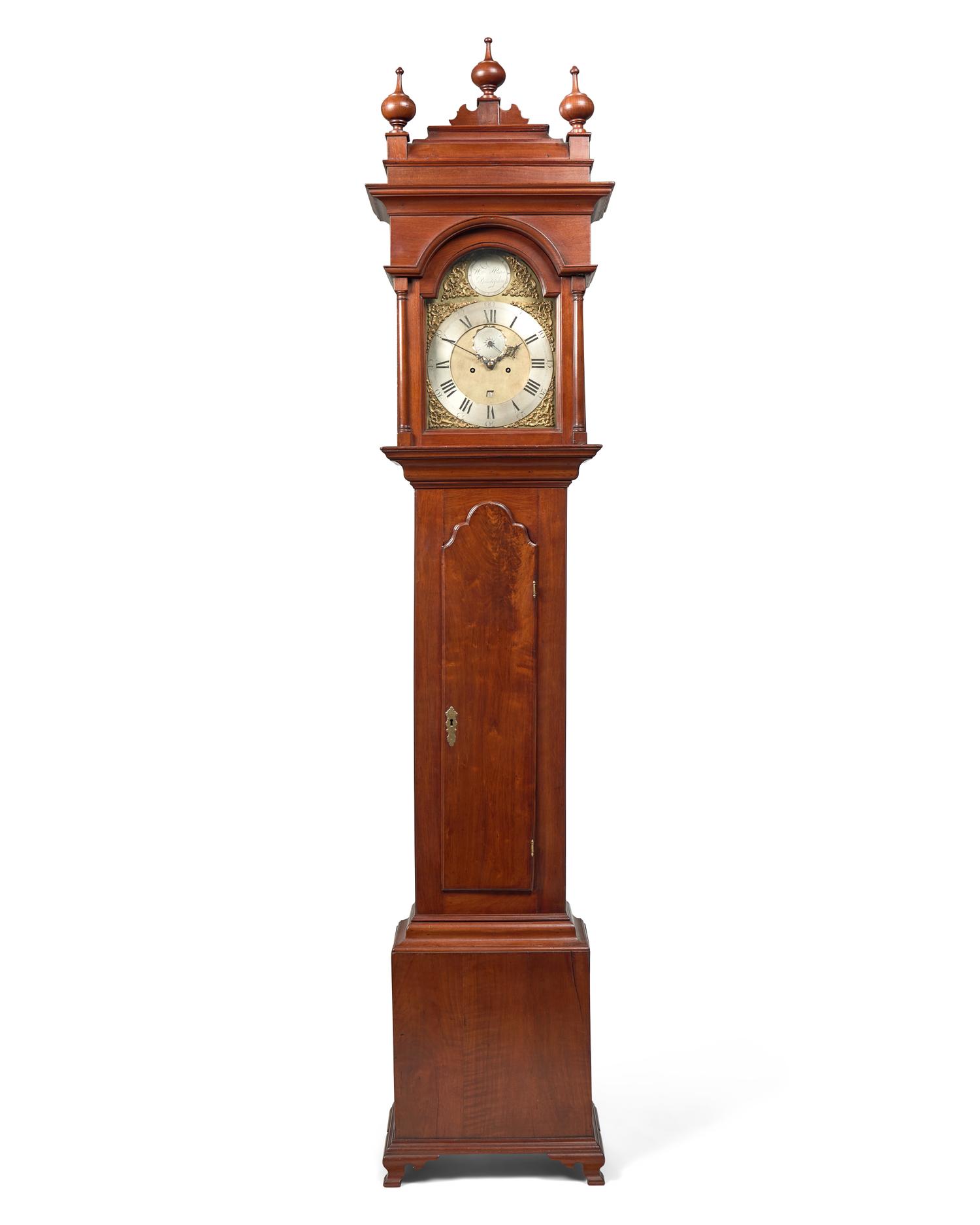 A Fine Queen Anne Carved and Figured Walnut Eight-Day Tall Case Clock