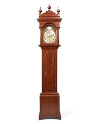 A Fine Queen Anne Carved and Figured Walnut Eight-Day Tall Case Clock