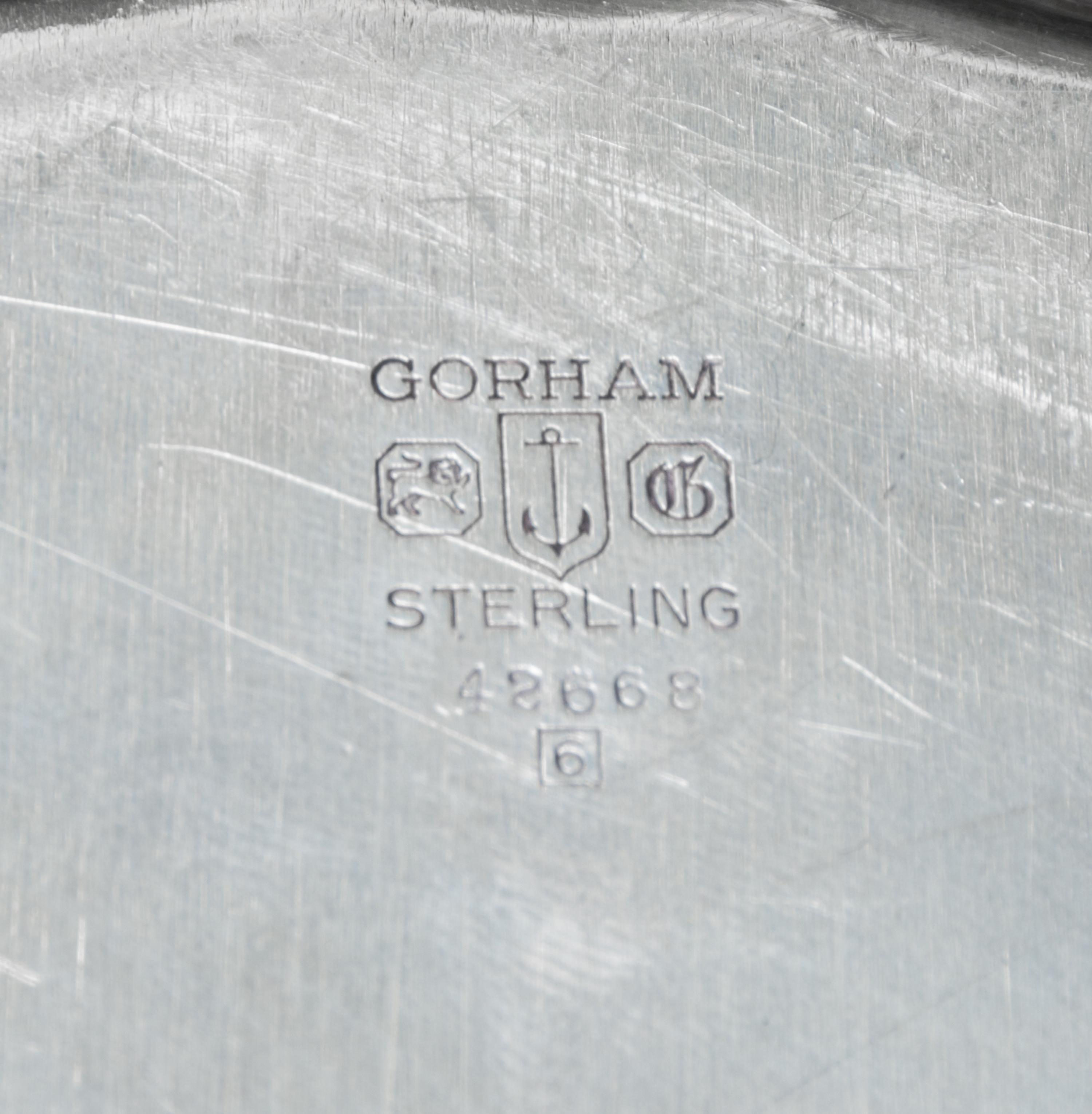 An American Silver Bowl, Gorham Mfg. Co., Providence, RI, Chippendale pattern, with a shaped circular border.