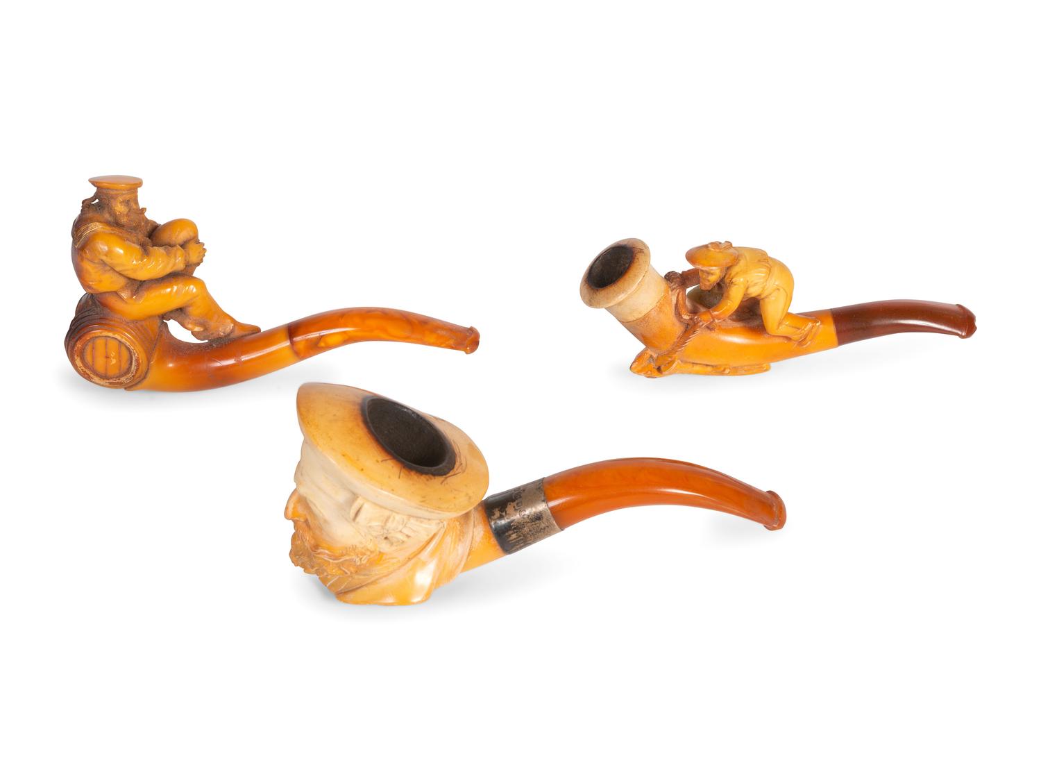 Three Carved Meerschaum Figural Pipes