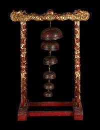 A Set of Gongs with Matching Carved Gilt and Red Lacquered Wood Stand
