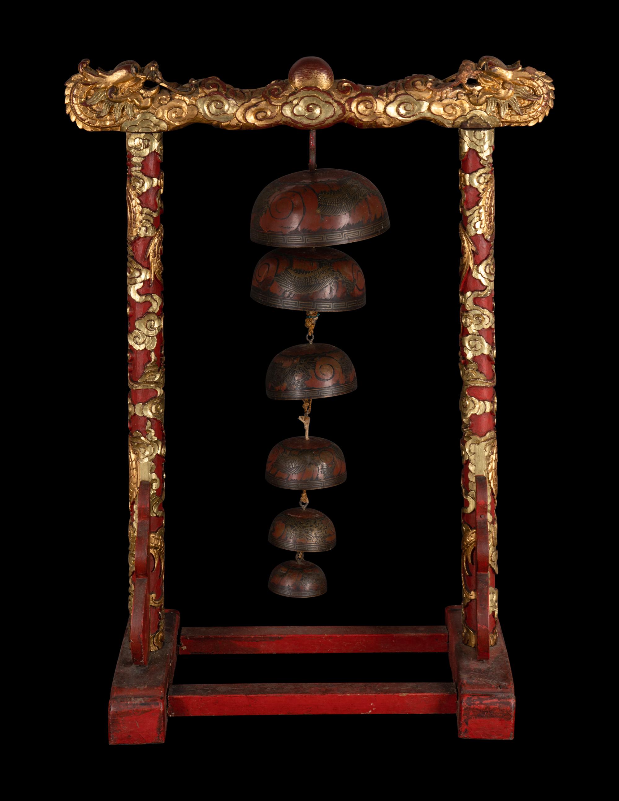 A Set of Gongs with Matching Carved Gilt and Red Lacquered Wood Stand