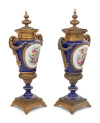 A Pair of Sèvres Style Gilt Bronze Mounted Porcelain Urns