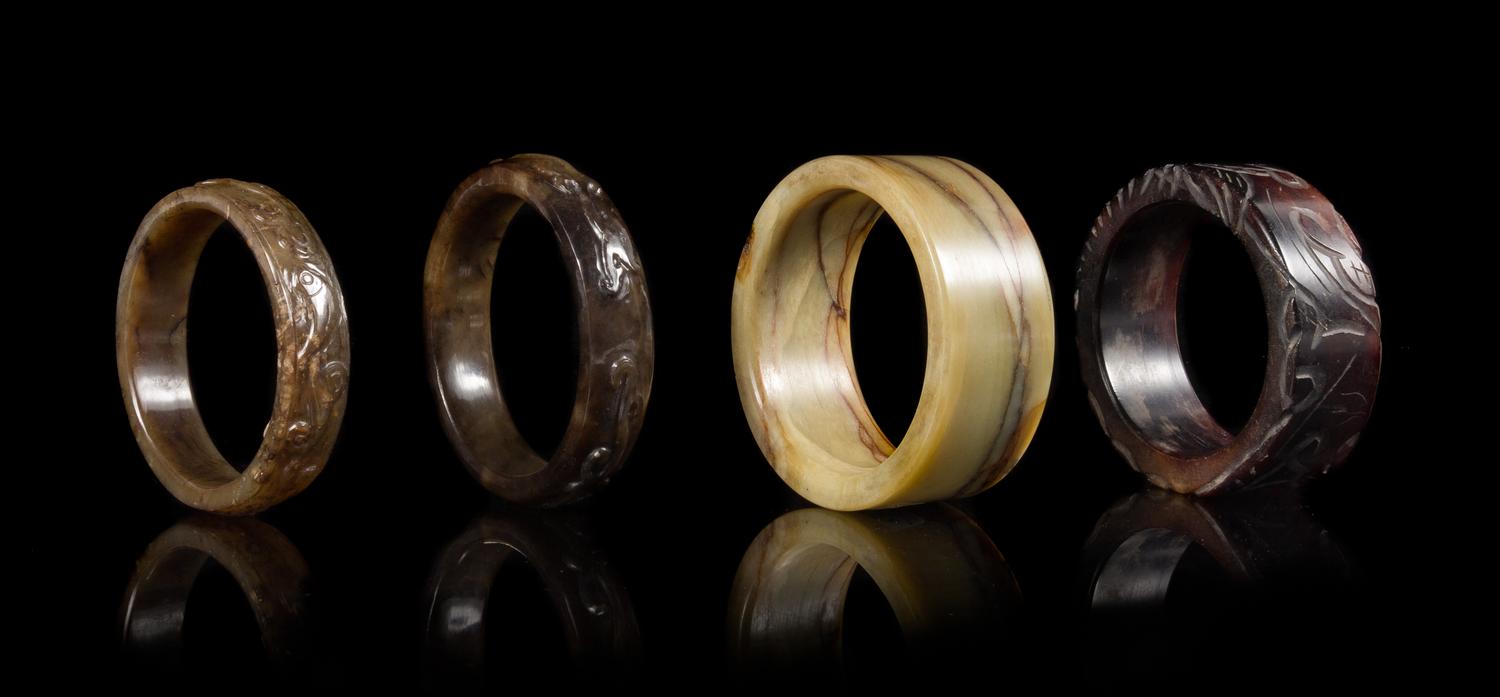 Four Archaistic Jade Bangles Diameter of largest interior 2 3/4 inches. — LATE QING/REPUBLIC PERIOD