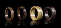 Four Archaistic Jade Bangles Diameter of largest interior 2 3/4 inches. — LATE QING/REPUBLIC PERIOD