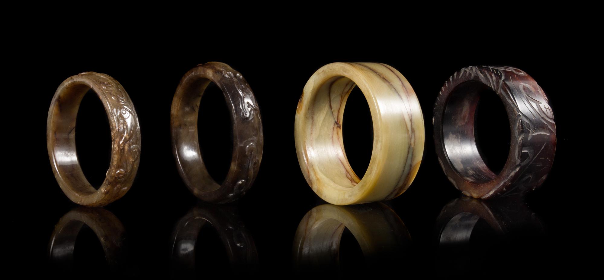 Four Archaistic Jade Bangles Diameter of largest interior 2 3/4 inches. — LATE QING/REPUBLIC PERIOD