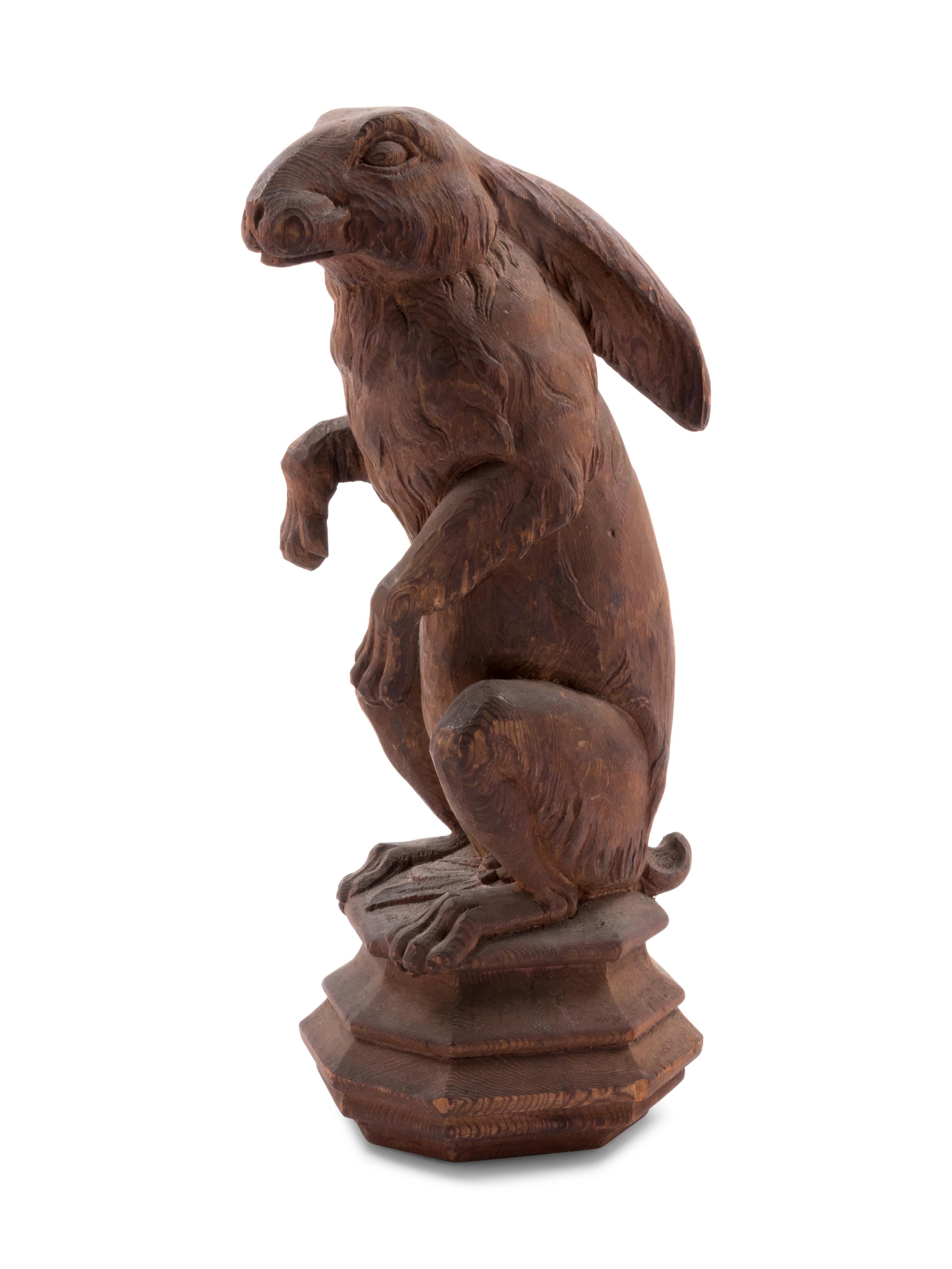 A Continental Carved Pine Figure of a Rabbit