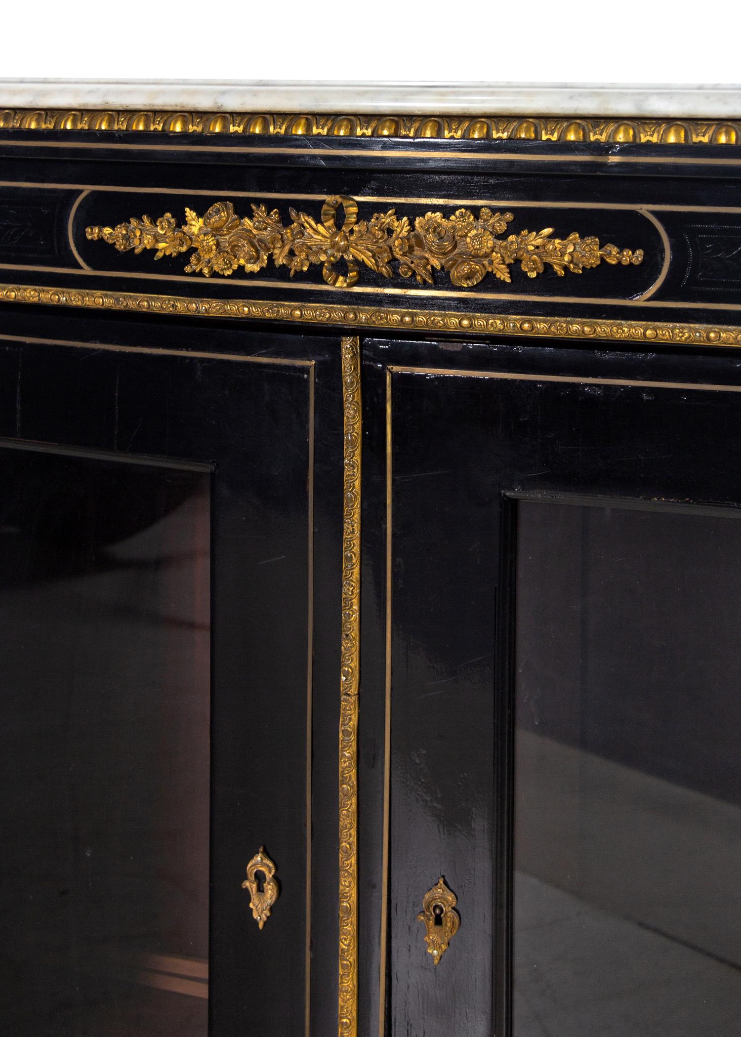 A Napoleon III Style Ebonized Marble-Top Cabinet