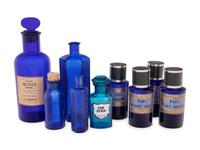 A Group of Blue Glass Apothecary Bottles