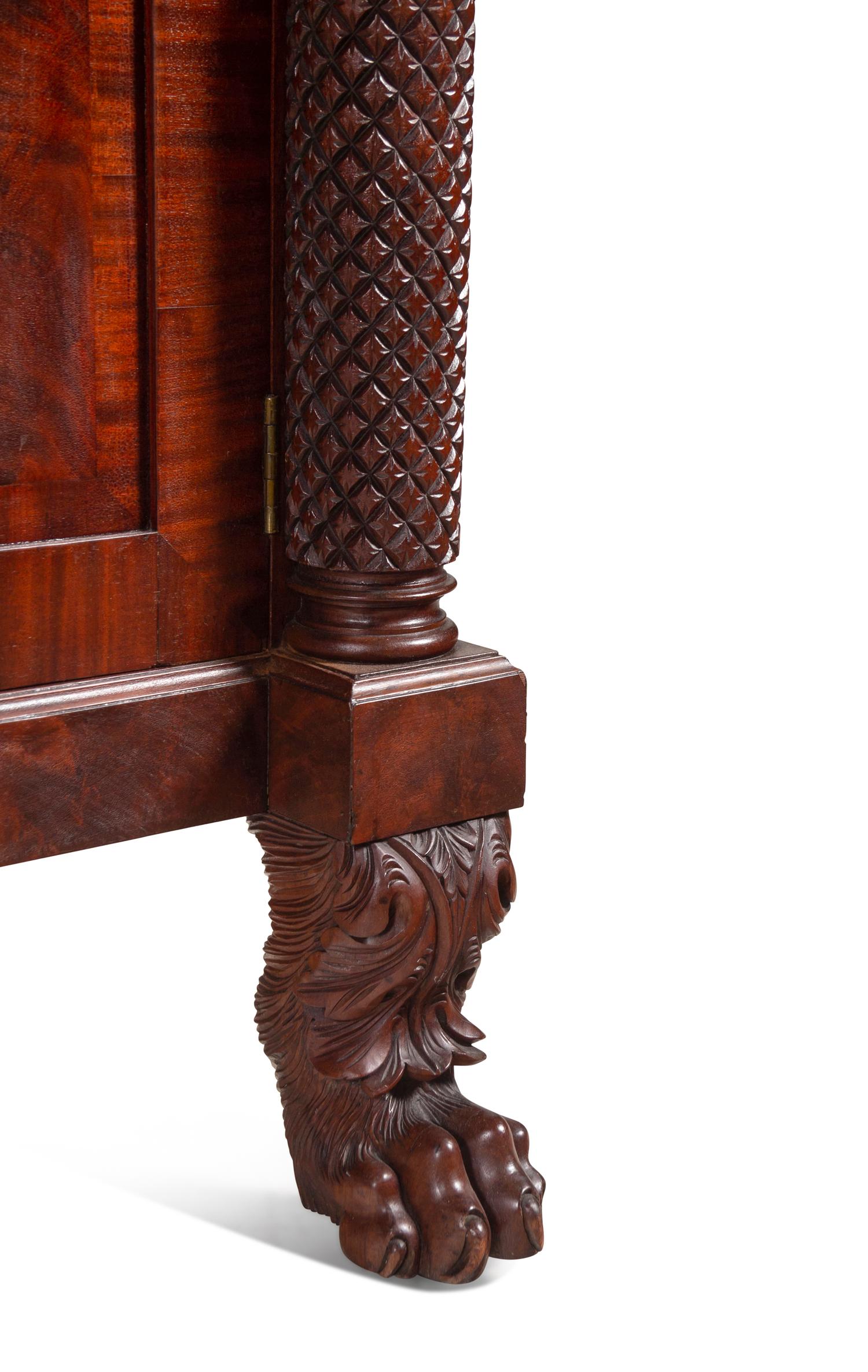 A Late Classical Carved and Highly Figured Mahogany Sideboard