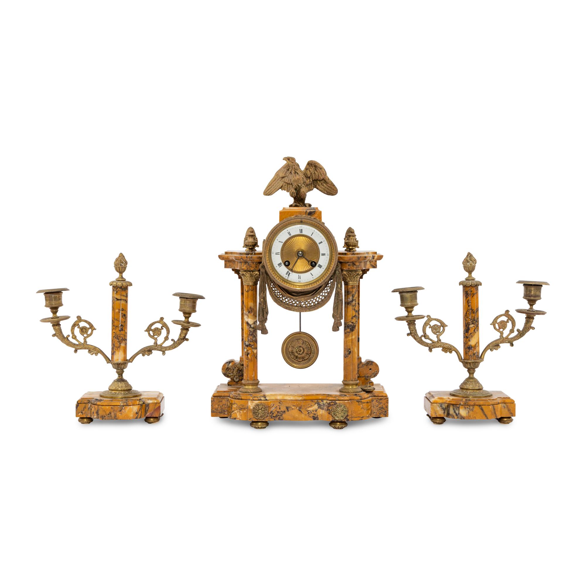 A French Gilt-Bronze and Sienna Marble Three-Piece Clock Garniture