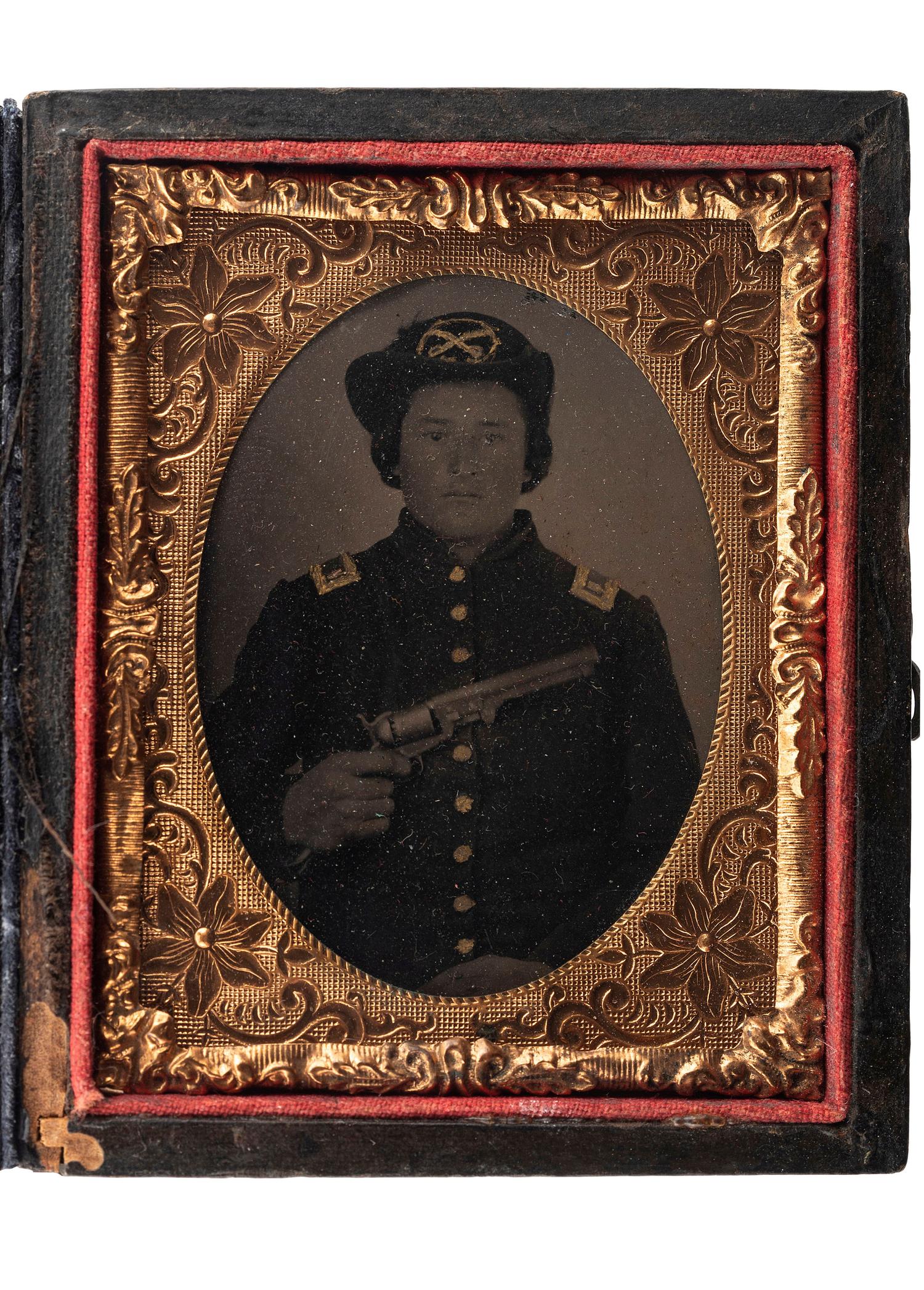 [CIVIL WAR]. Ninth plate tintype of Union cavalry officer displaying a Model 1851 Colt Navy revolver.