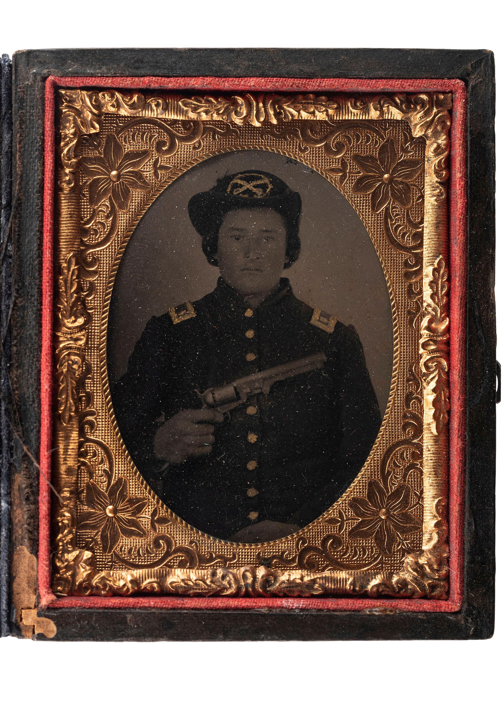[CIVIL WAR]. Ninth plate tintype of Union cavalry officer displaying a Model 1851 Colt Navy revolver.