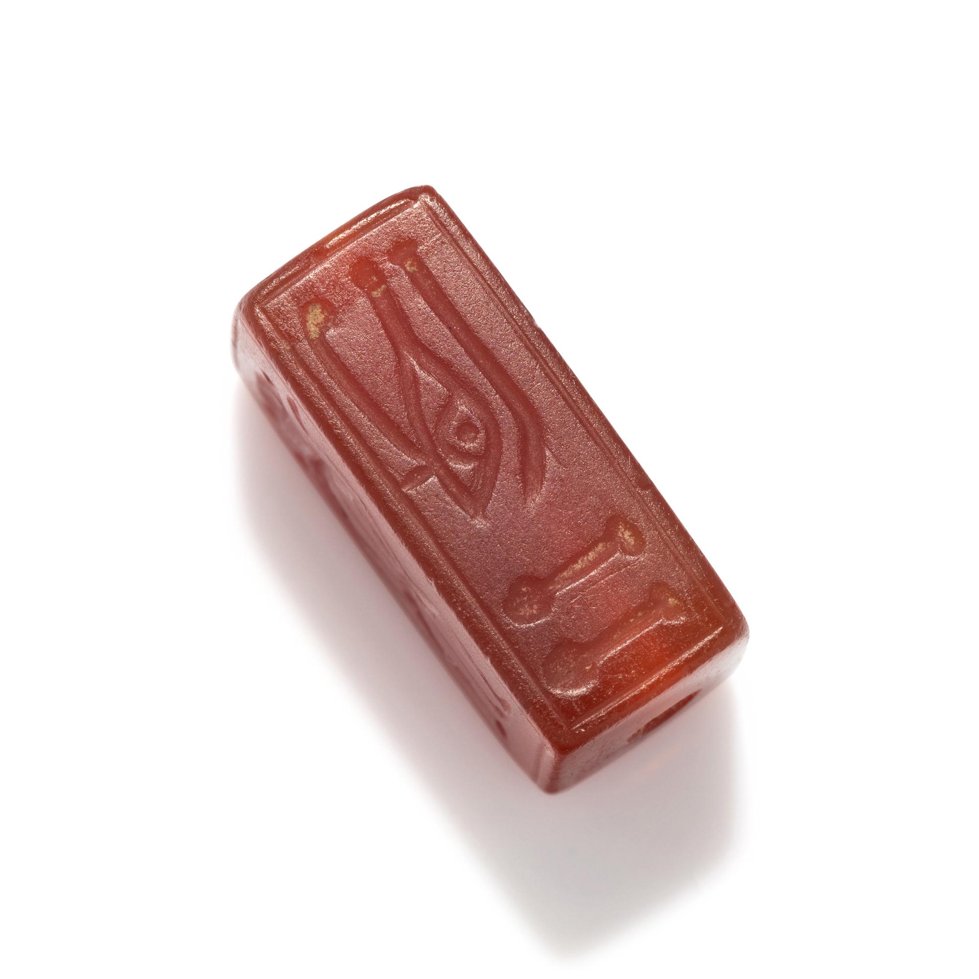 An Egyptian Carnelian Incised Bead with the Cartouche of Amenhotep III