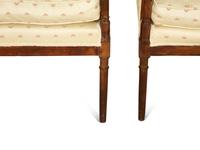 A Pair of Directoire Style Fruitwood Bergères