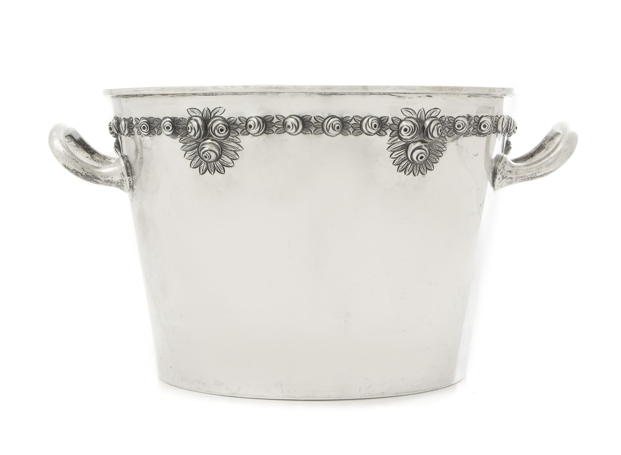 A Mexican Silver Ice Bucket, Sanborns, Mexico City, 20th Century, the tapering body with twin handles and a repousee band of rosettes.