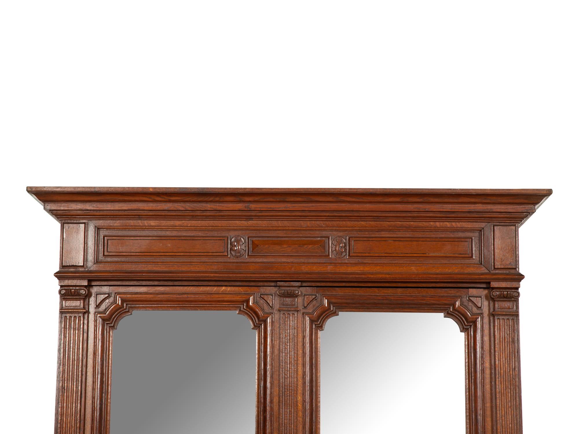 An English Carved Oak Bureau Cabinet