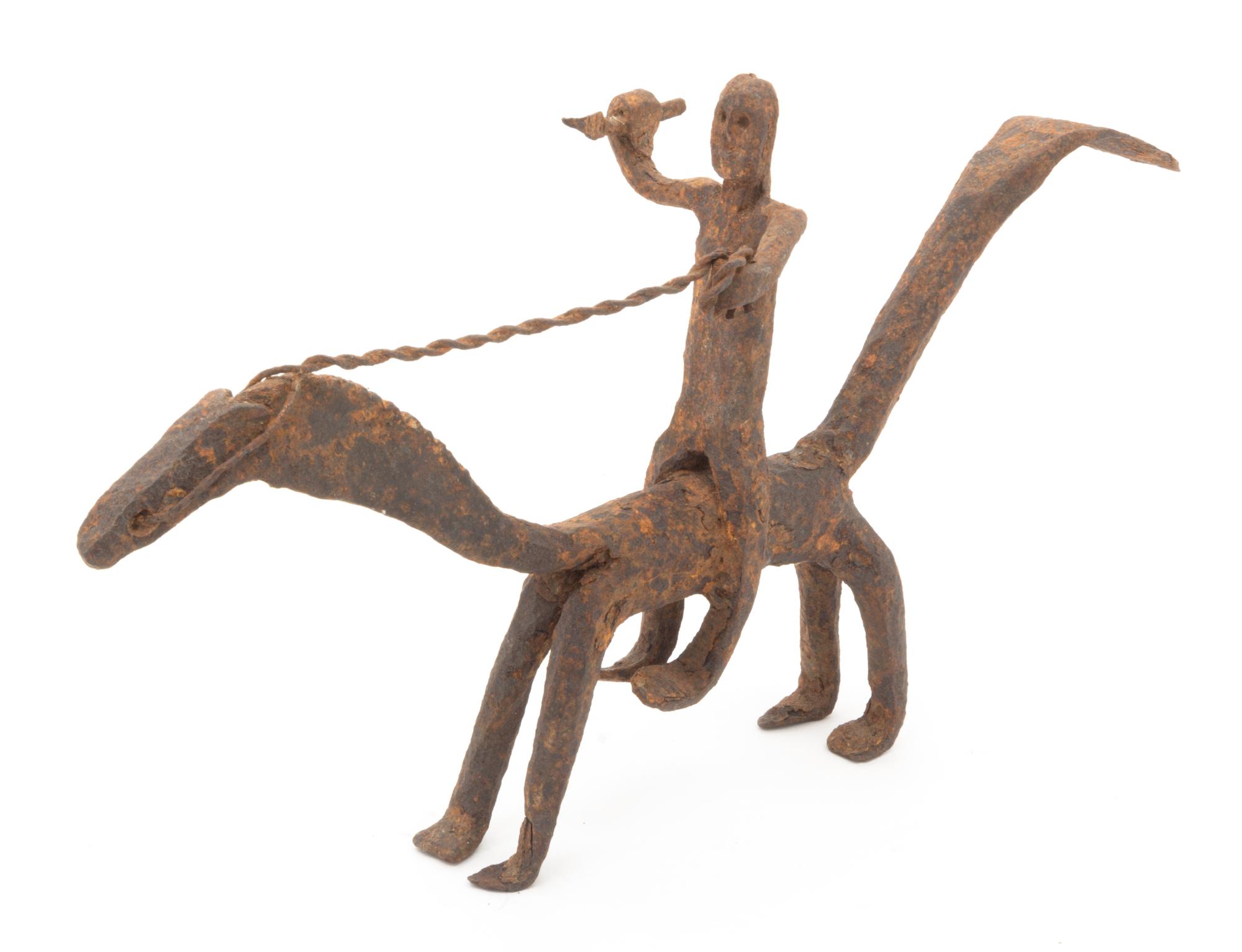 An Ethnographic Cast Metal Figure Width 15 3/4 inches.
