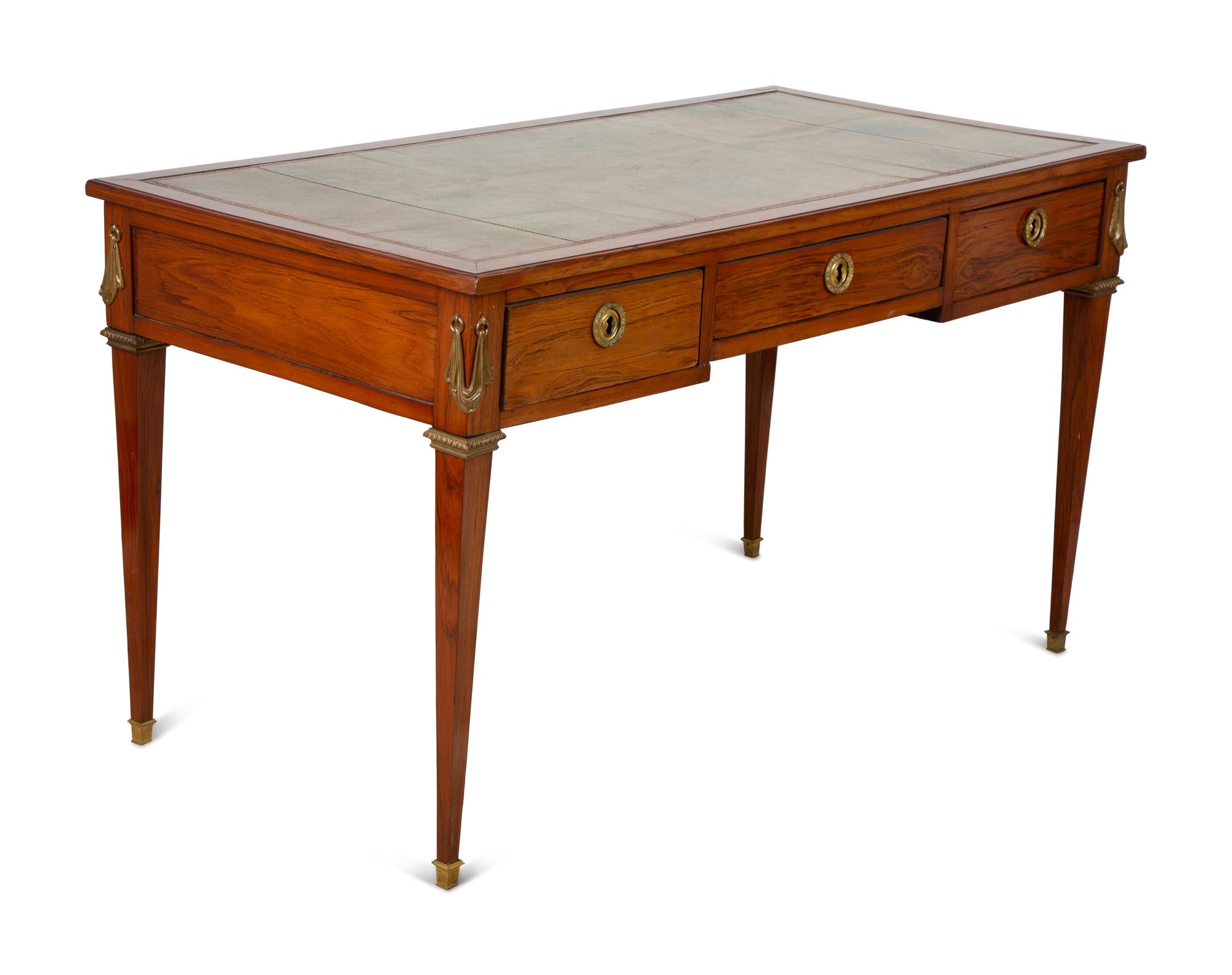 A French Gilt Bronze Mounted Mahogany Bureau Plat