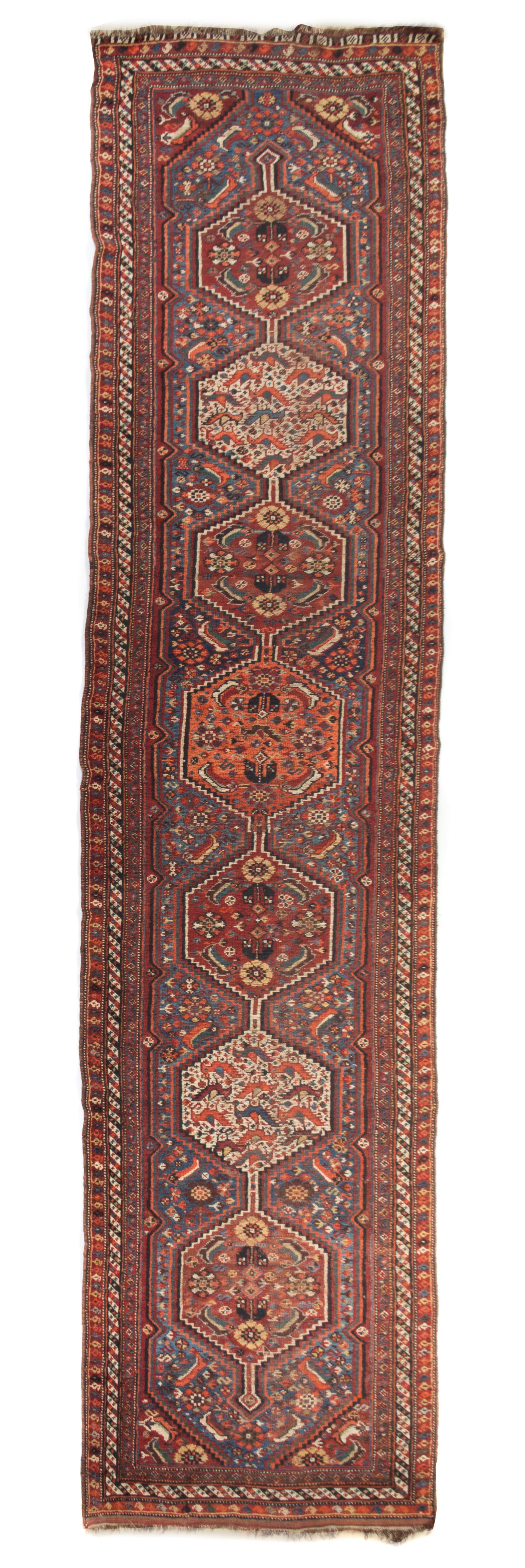 A Persian Wool Runner 12 feet 8 inches x 2 feet 11 1/4 inches.