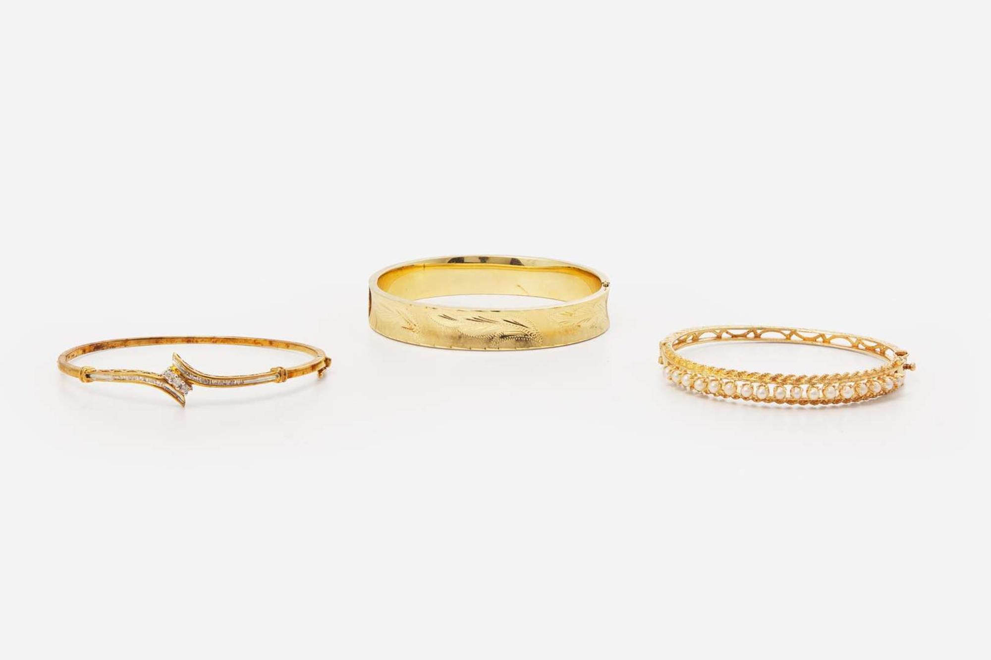 A Collection of Yellow Gold Bangles