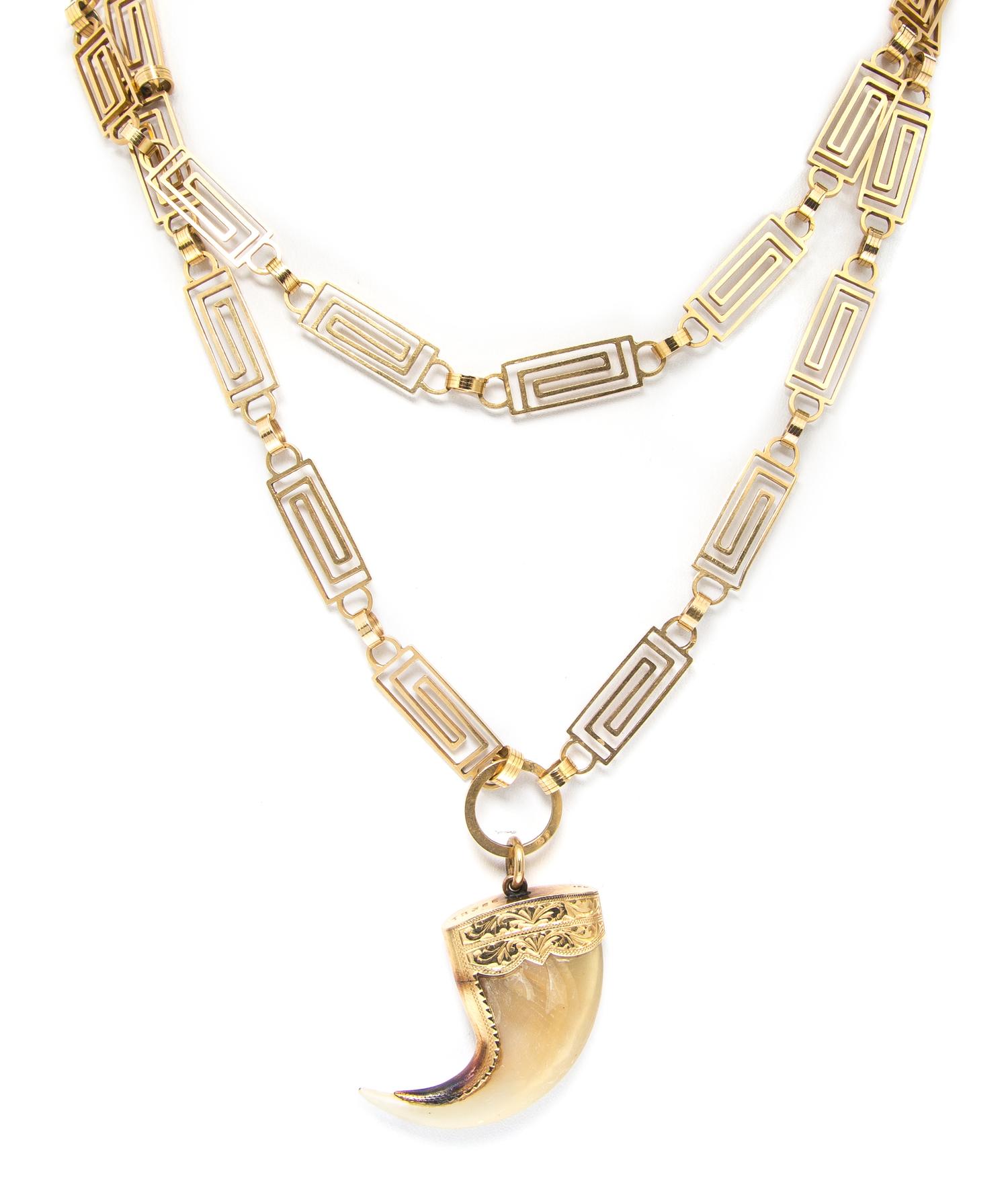 An 18 Karat Yellow Gold Greek Key Motif Longchain, French, With 18 Karat Yellow Gold and Tiger Claw Pendant, 45.20 dwts.