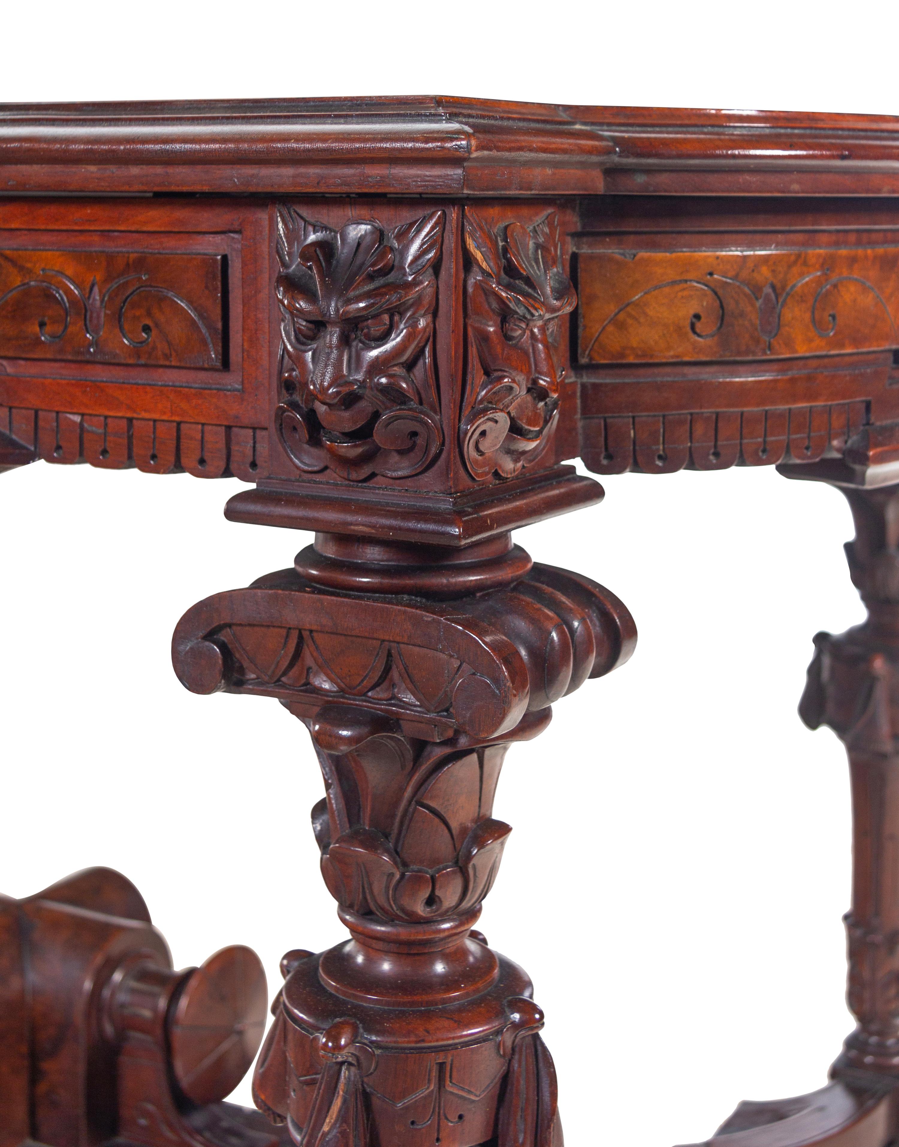 A Victorian Carved, Inlaid and Painted Walnut Writing Desk