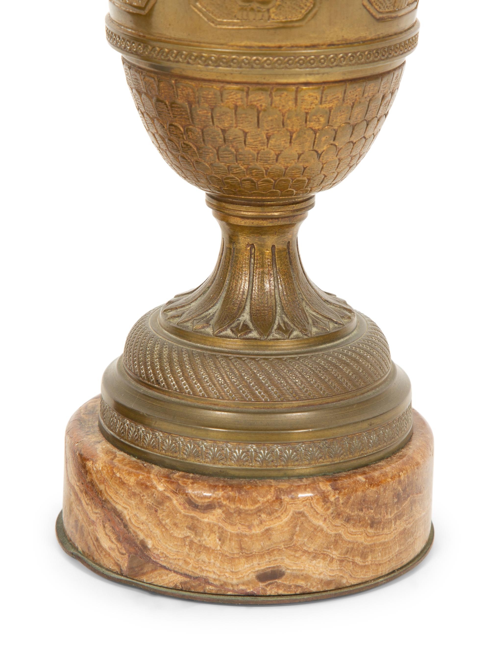 A Pair of Continental Gilt Bronze and Onyx Urns