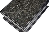 A Repousse Metal and Cabochon-Inset Humidor