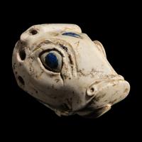 A Mesopotamian Marble and Lapis Lazuli Inlay Bull Head