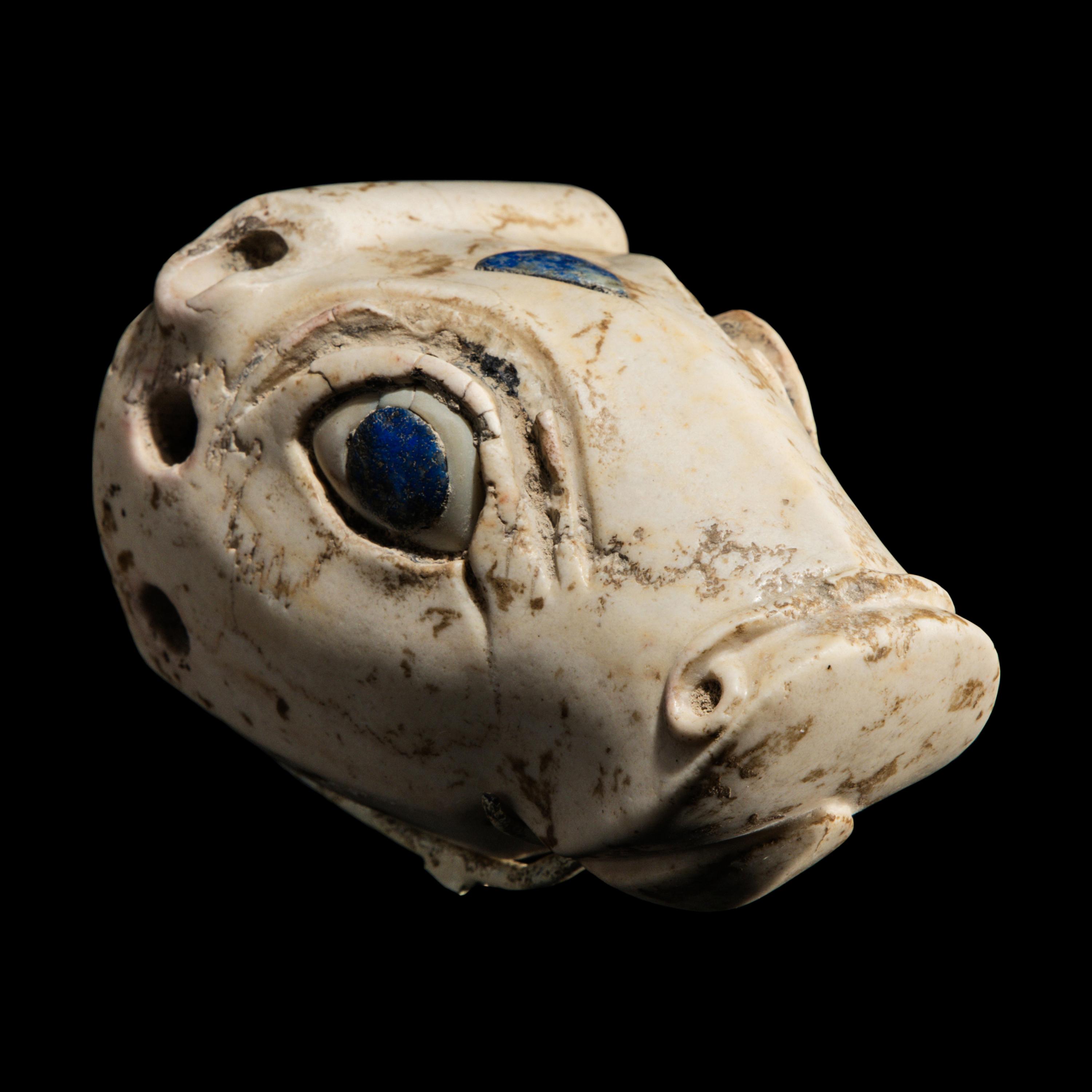 A Mesopotamian Marble and Lapis Lazuli Inlay Bull Head