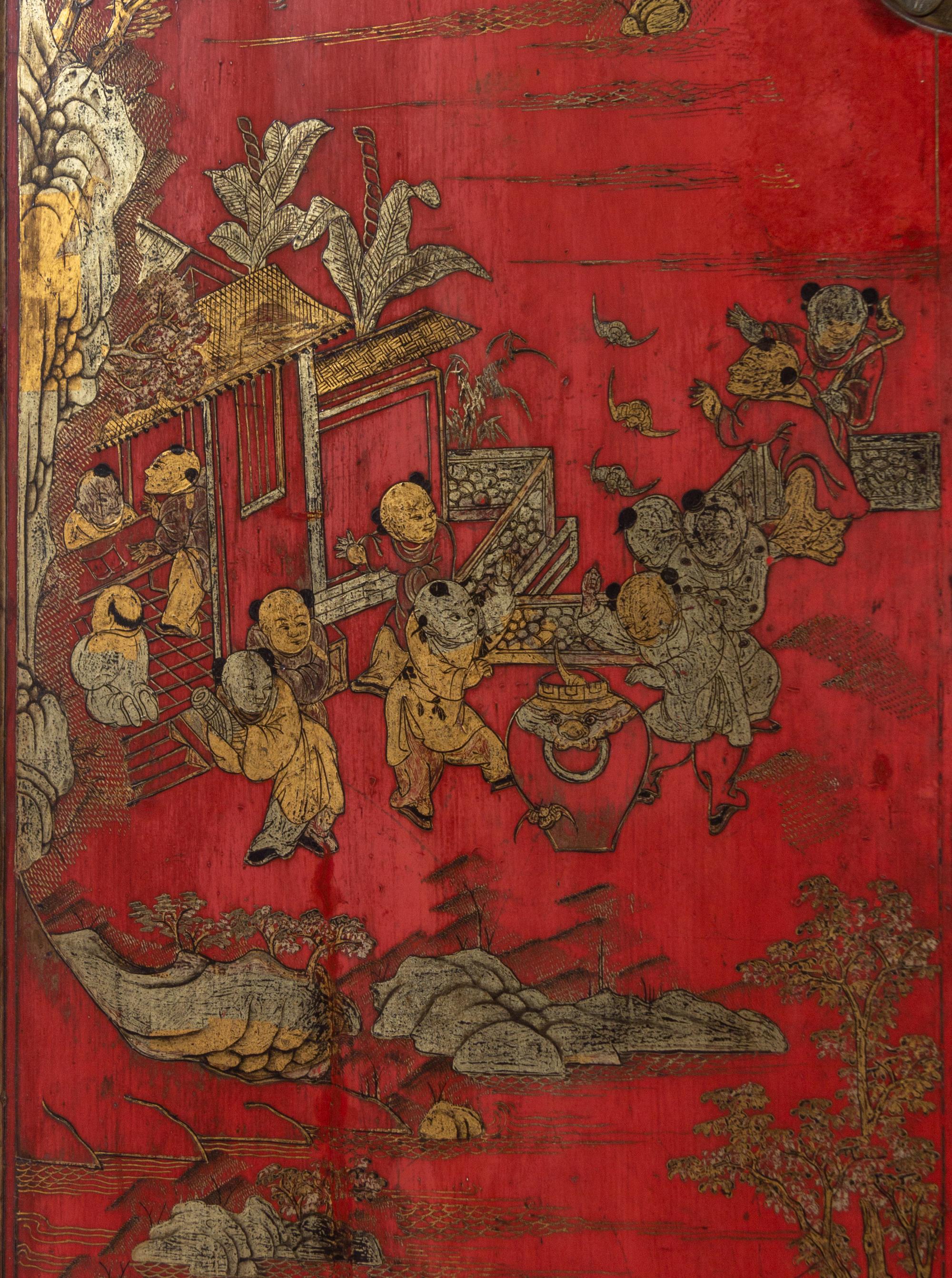 A Chinese Gilt Decorated Red Lacquer Corner Cabinet