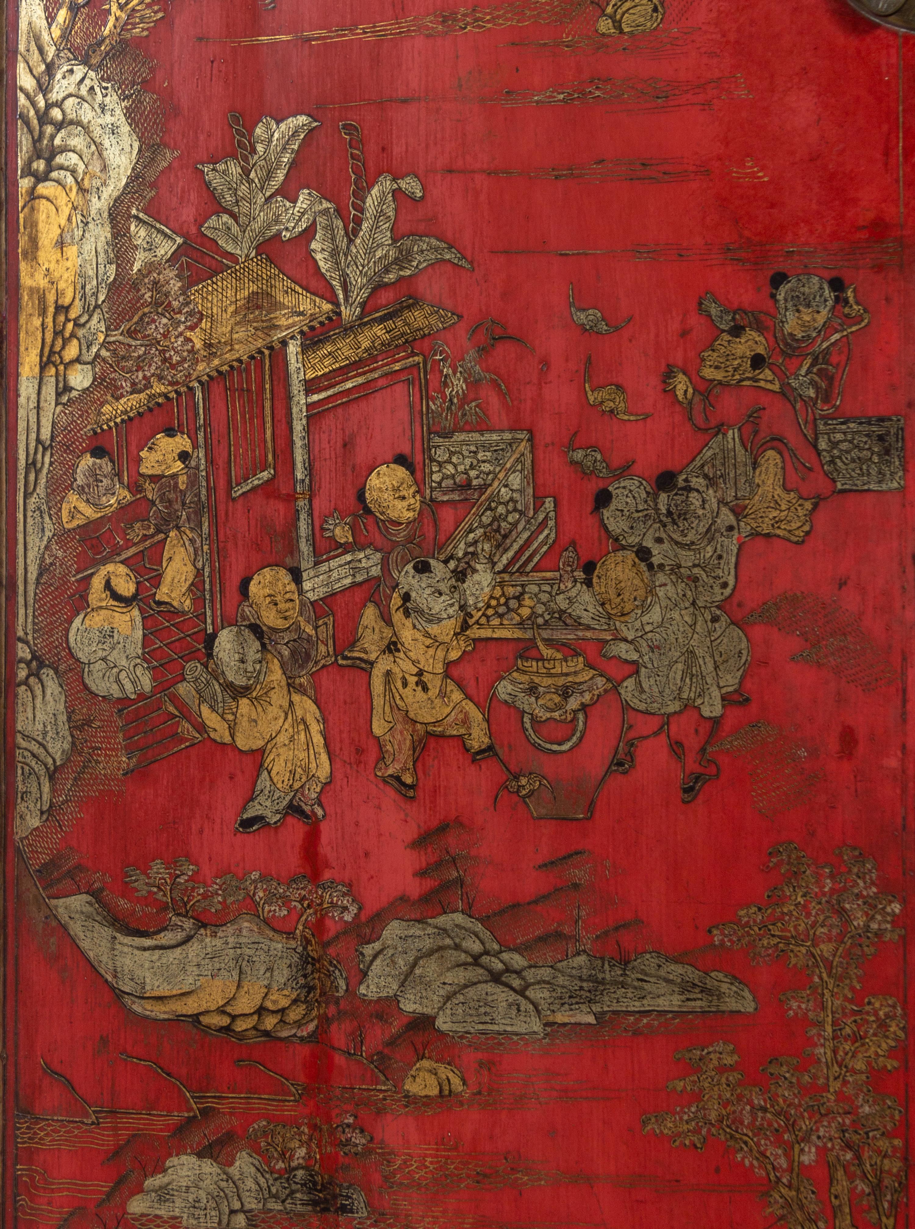 A Chinese Gilt Decorated Red Lacquer Corner Cabinet