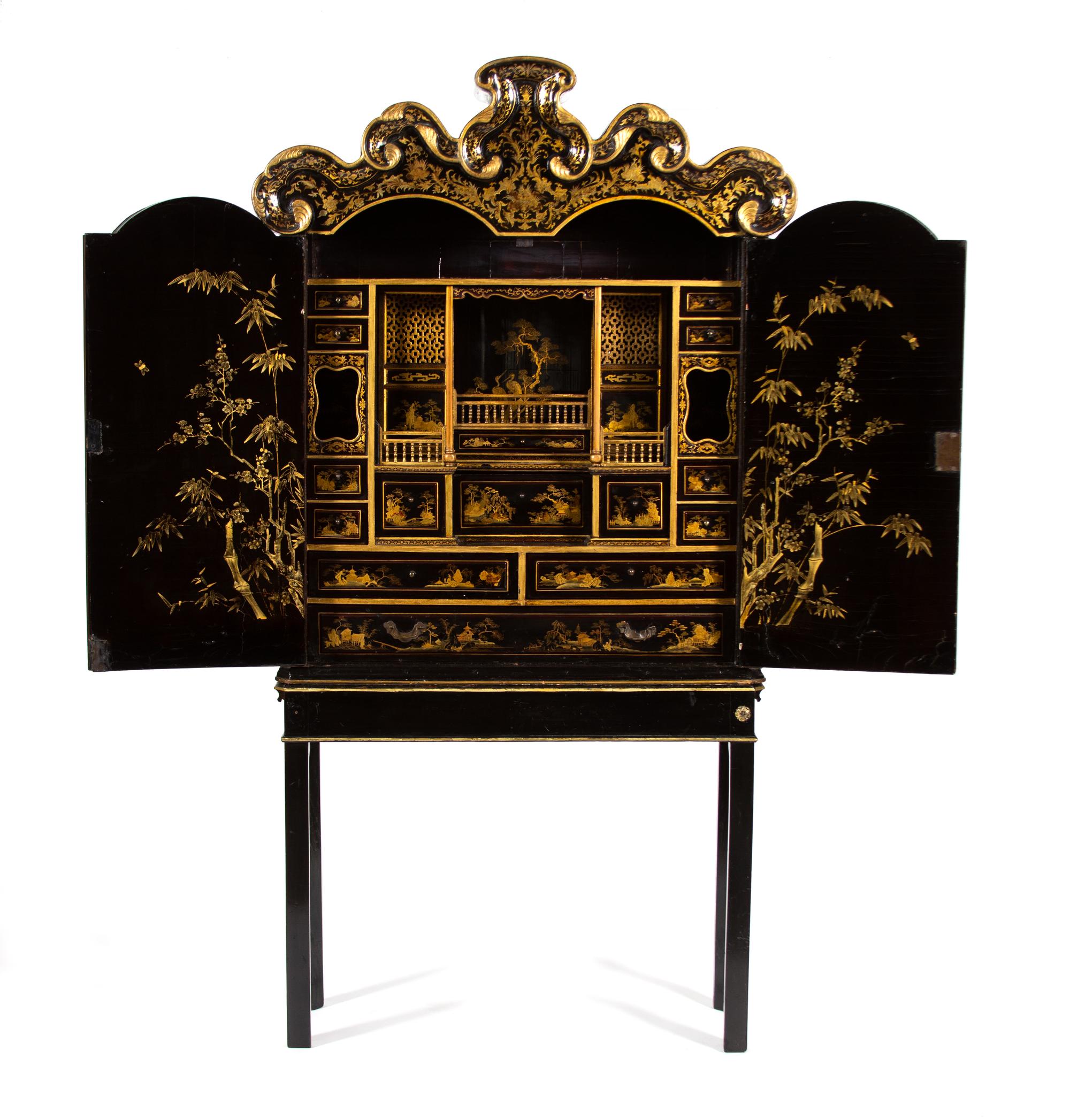 A Chinese Black and Gilt Lacquer Cabinet Height 81 3/4 x width 42 1/2 x depth 13 inches. — 18TH CENTURY
