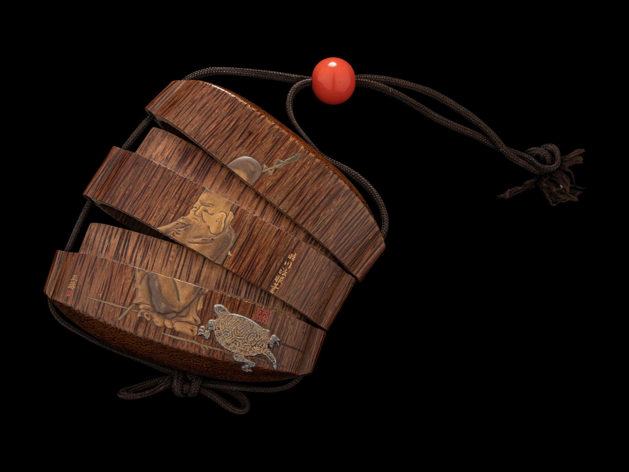 A Japanese Gold and Brown Lacquered Wood Two-Case Inro