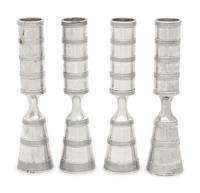 A Set of Four Danish Silvered Metal Candlesticks