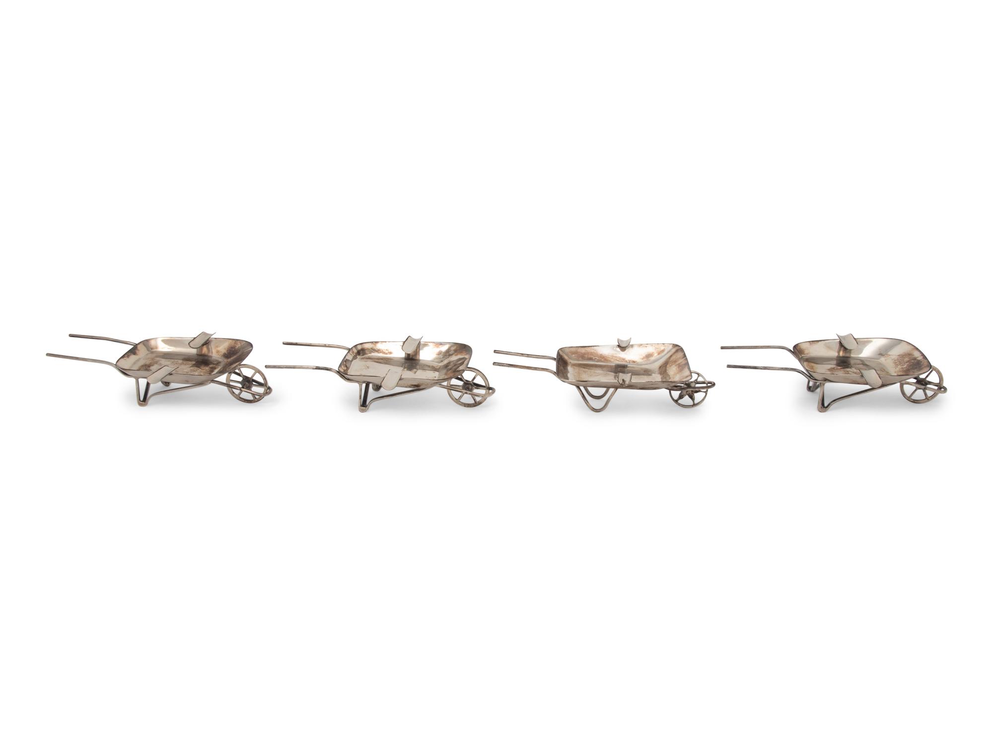 An Assembled Set of Four Mexican Silver Wheelbarrow-Form Ash Trays