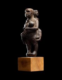 An Egyptian Wood Woman Holding Two Children