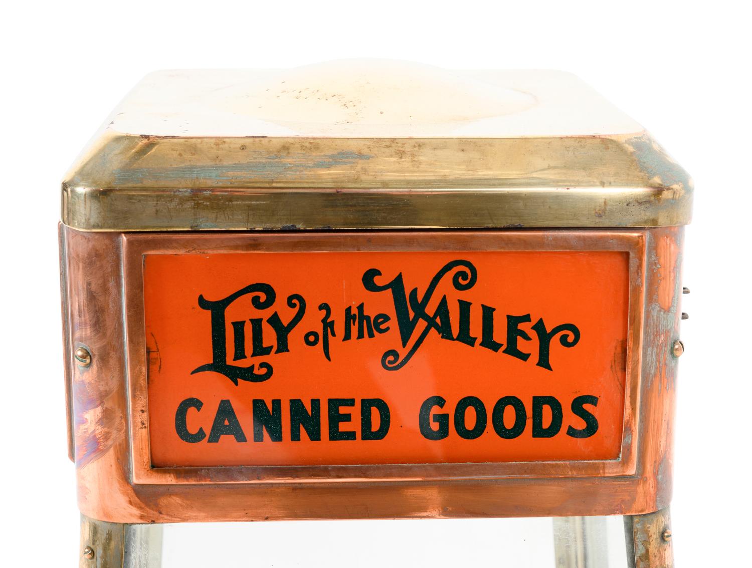 A Dwinell-Wright Co. Coffee Advertising Box, along with a Copper and Brass Colonial Coffee and Lily of the Valley Canned Goods Counter Top Vitrine Display Case