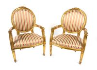 A Pair of Louis XVI Style Giltwood Fauteuils Height 39 inches. — 19TH CENTURY