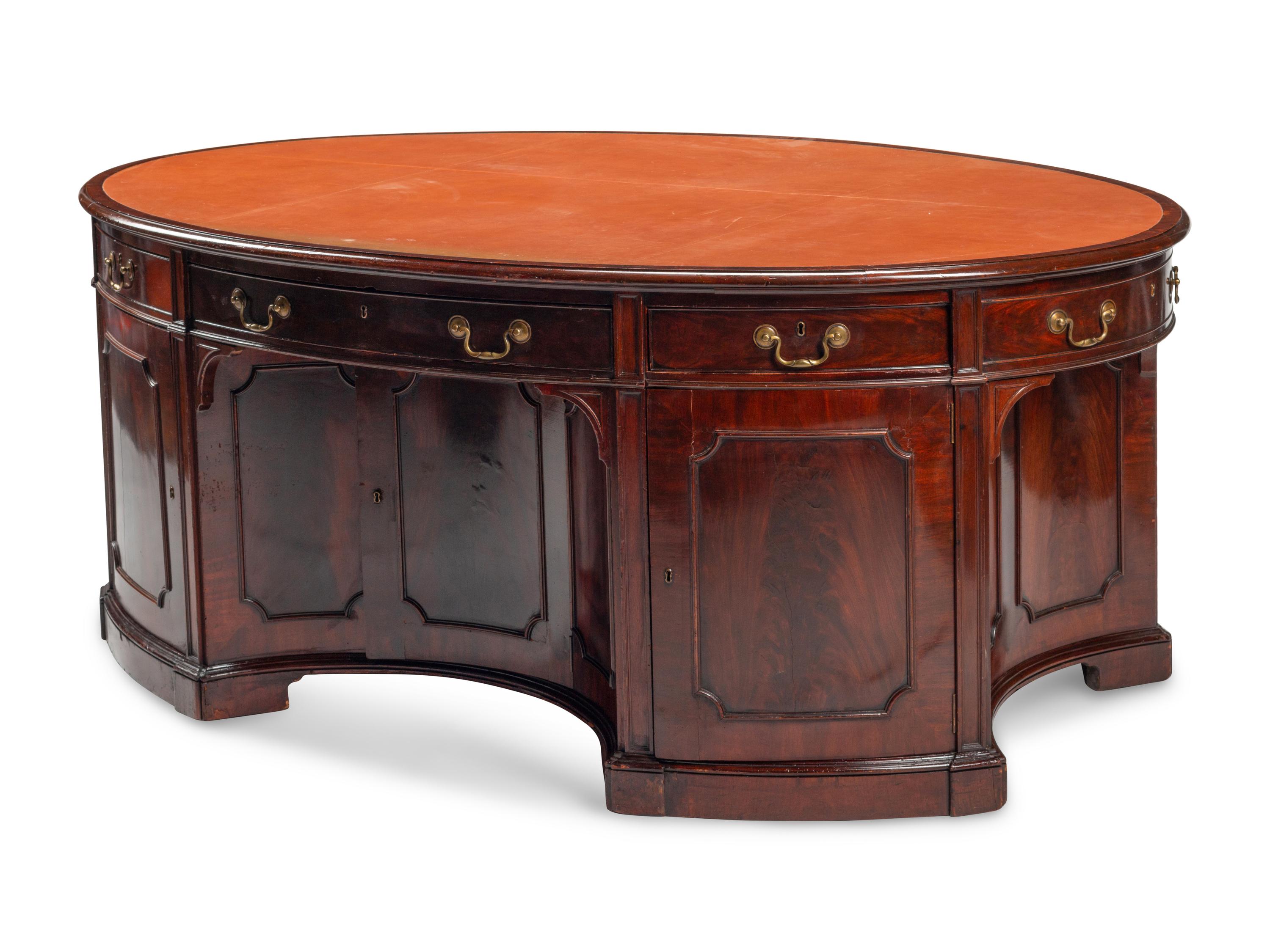 An English Mahogany Oval Partners Desk