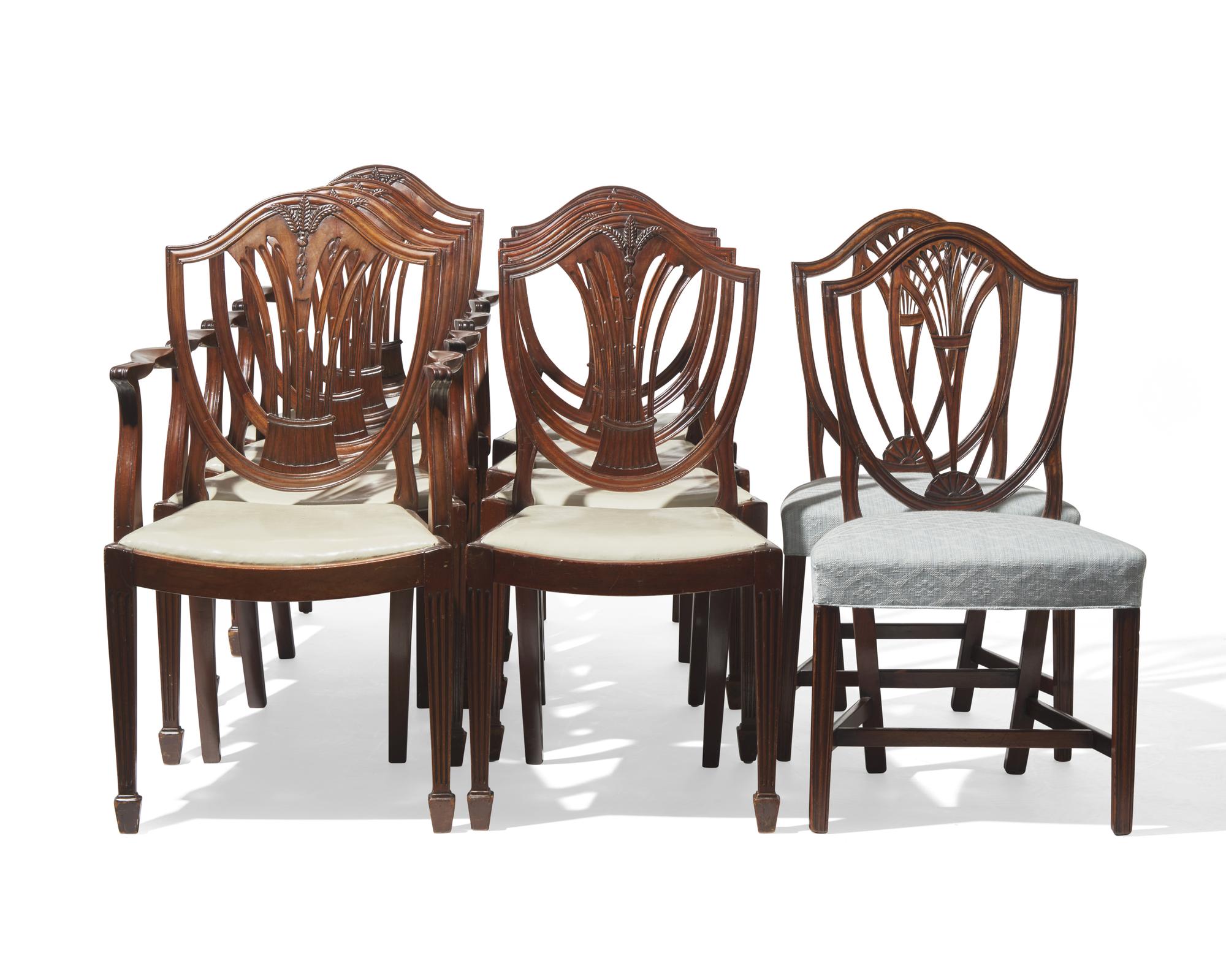 An assembled group of ten George III shield-back carved mahogany dining chairs, 18th / 19th century