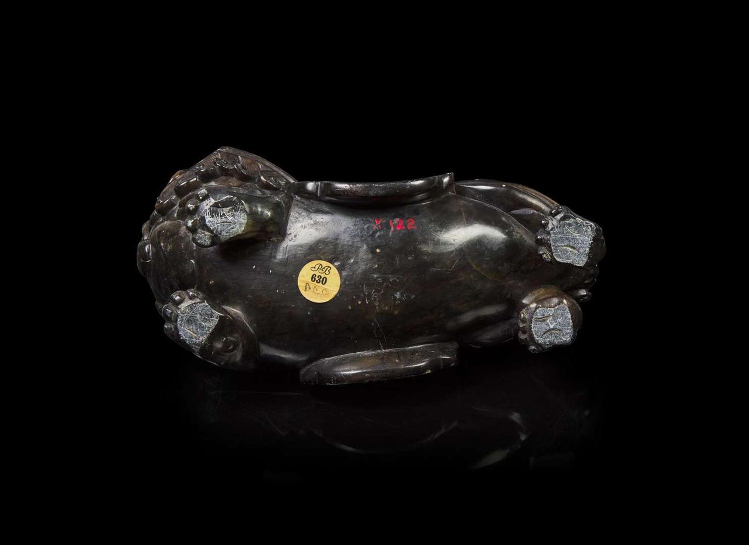 A Chinese carved mottled dark brown soapstone Buddhist lion, 18th century or earlier 壽山石獅子 十八世紀或更早