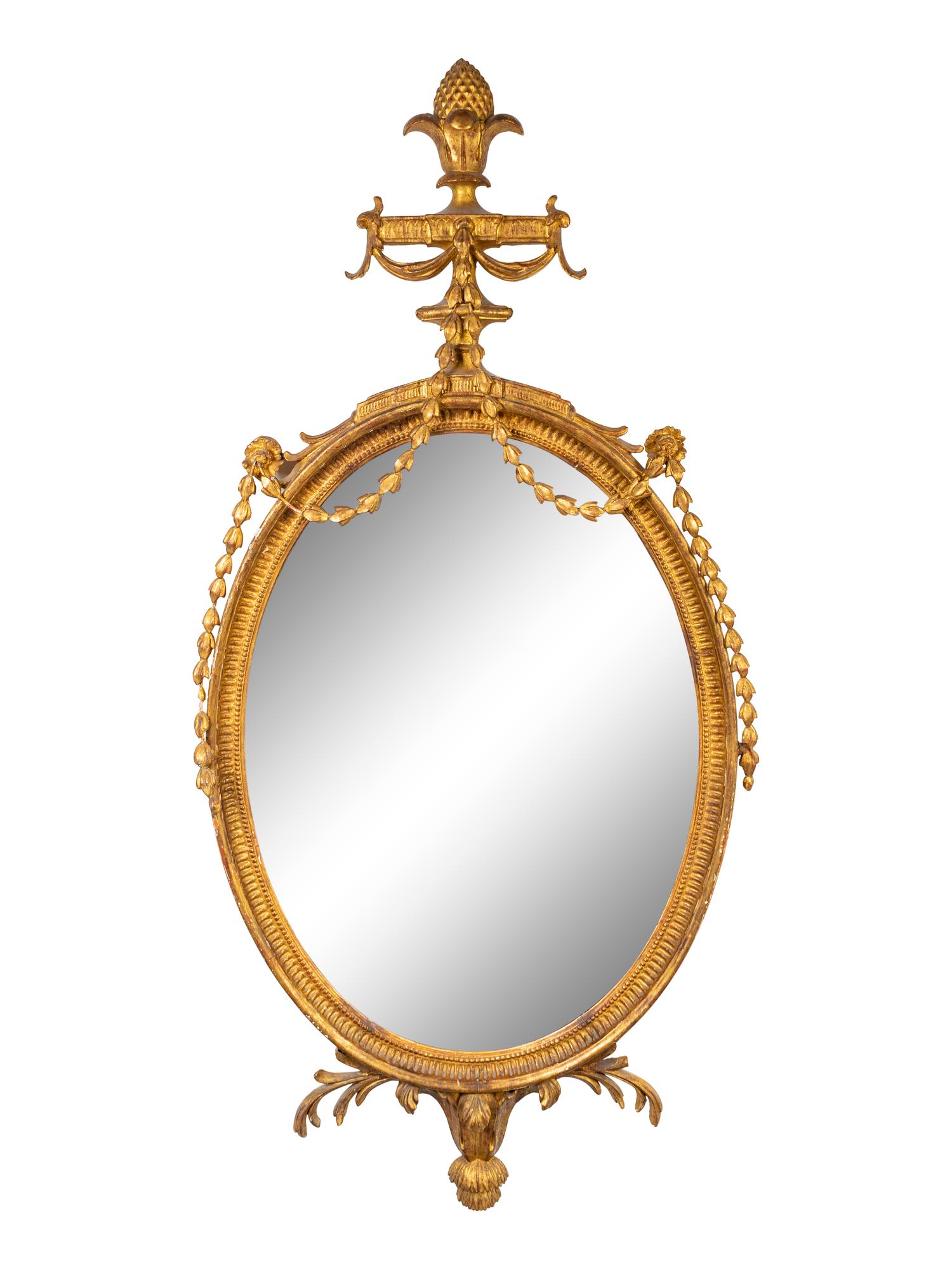 A George III Style Carved Giltwood Oval Mirror — 19TH CENTURY