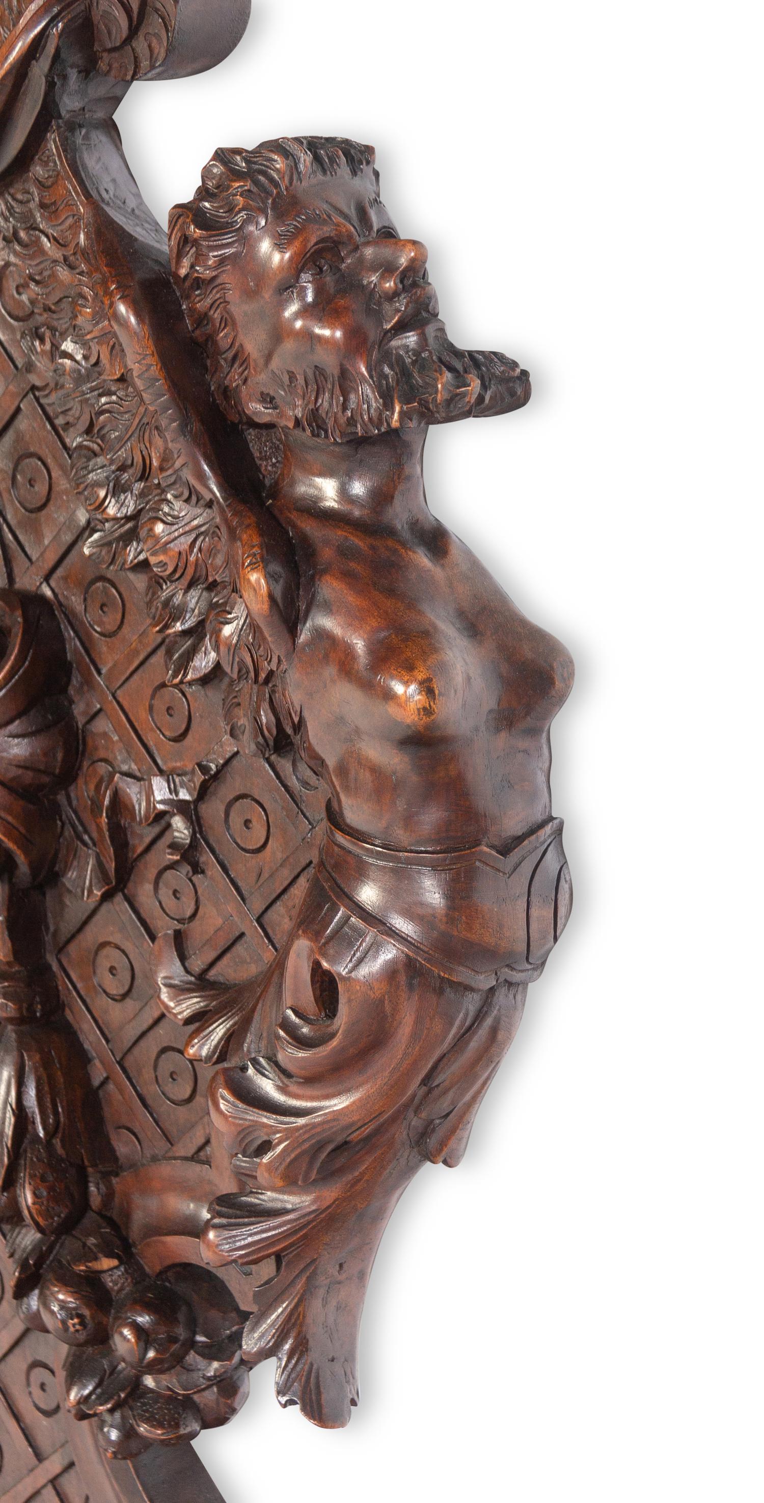 A Pair of Italian Baroque Style Carved Walnut Benches
