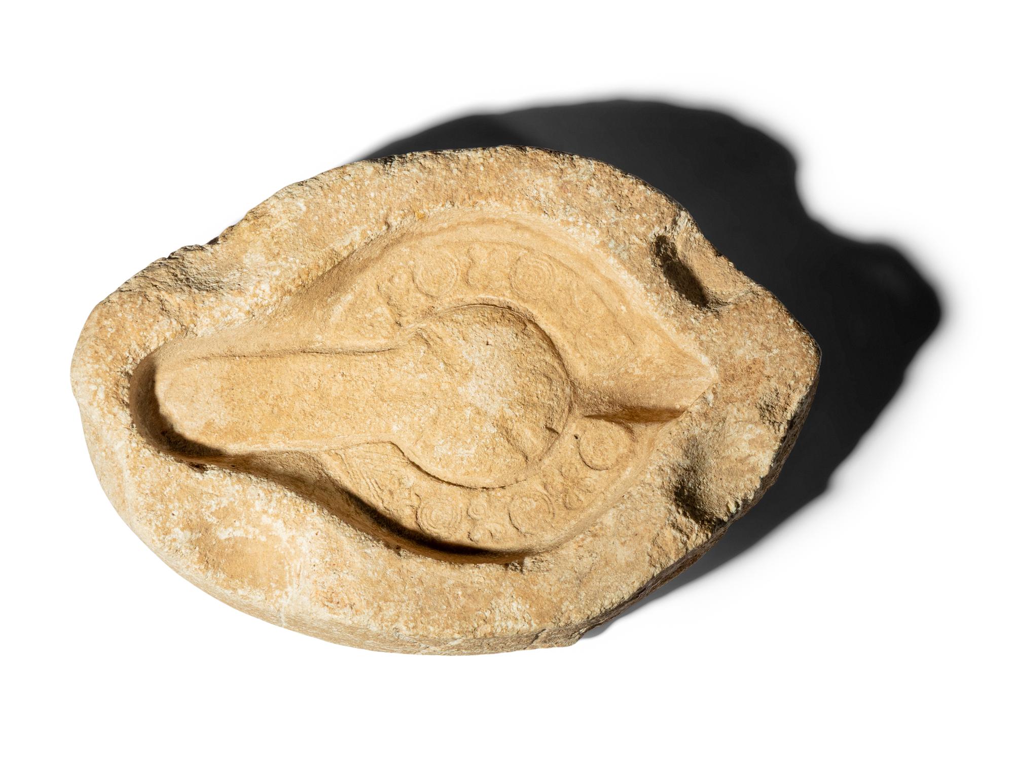 A Byzantine Black Stone Lamp with Crosses and a Byzantine Limestone Lamp Mold with a Chi Rho