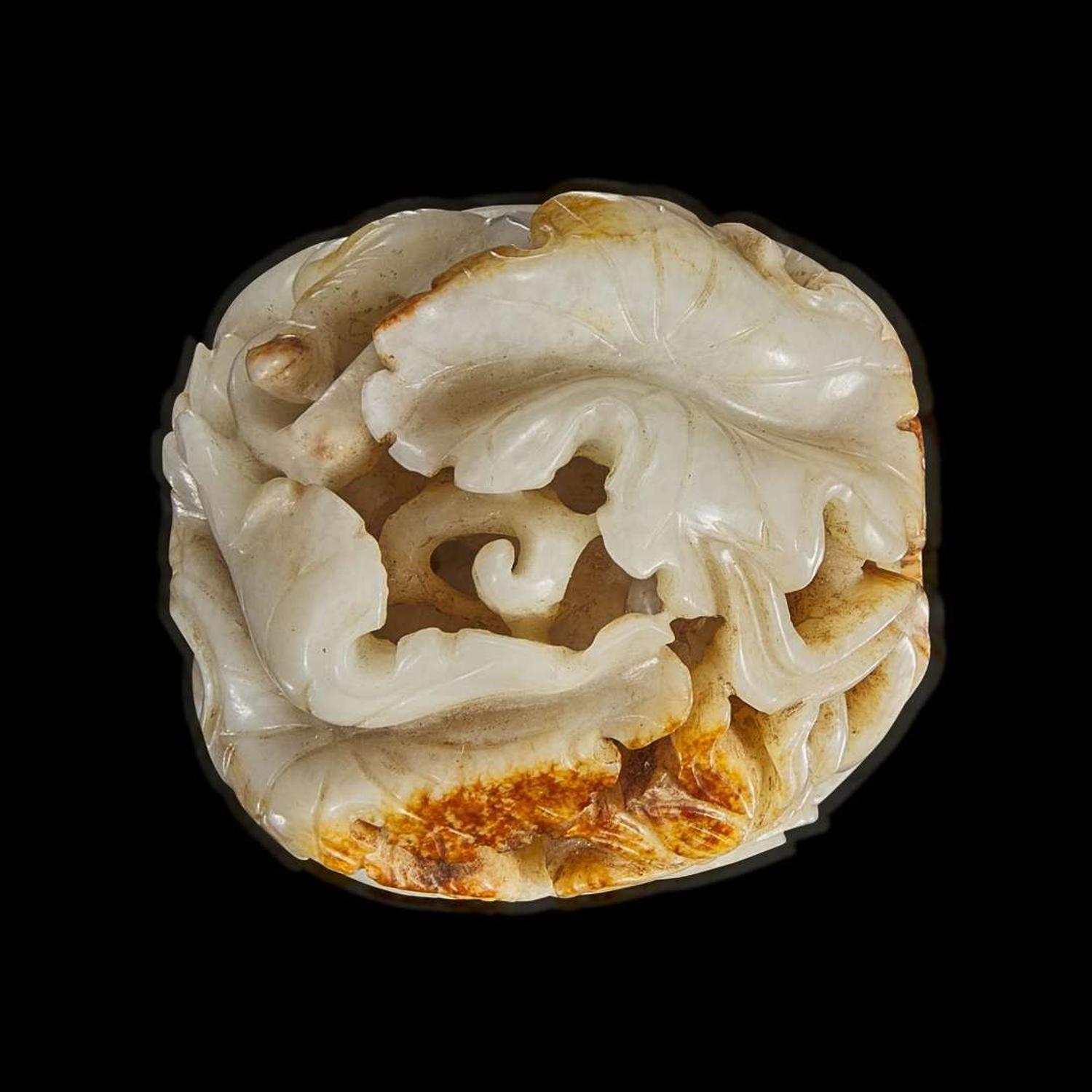 A Chinese reticulated white and russet jade finial 透雕玉炉端